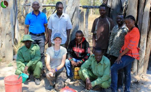 Team and beekeepers in a camp in the forest